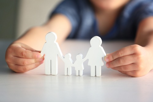 child holding up family image