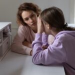 Caring,Mother,Talking,To,Stressed,Unhappy,Adolescent,Daughter,,Helping,In